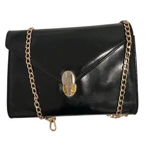 Black and Gold Crossbody Bag with Skull Clasp